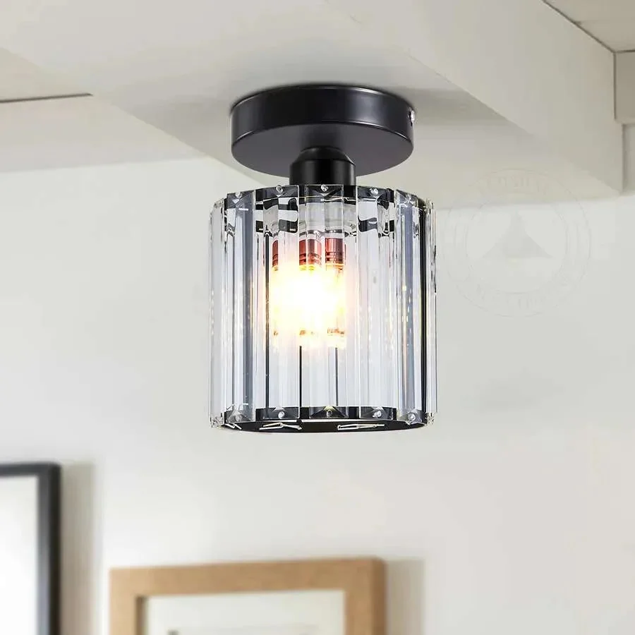 Modern round crystal chandelier lamp with brass finish and clear glass, suitable for dimmable LED lighting in living spaces