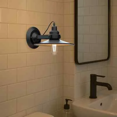 Adjustable swing arm wall light with flat metal shade mounted on a wall, ideal for focused indoor lighting.