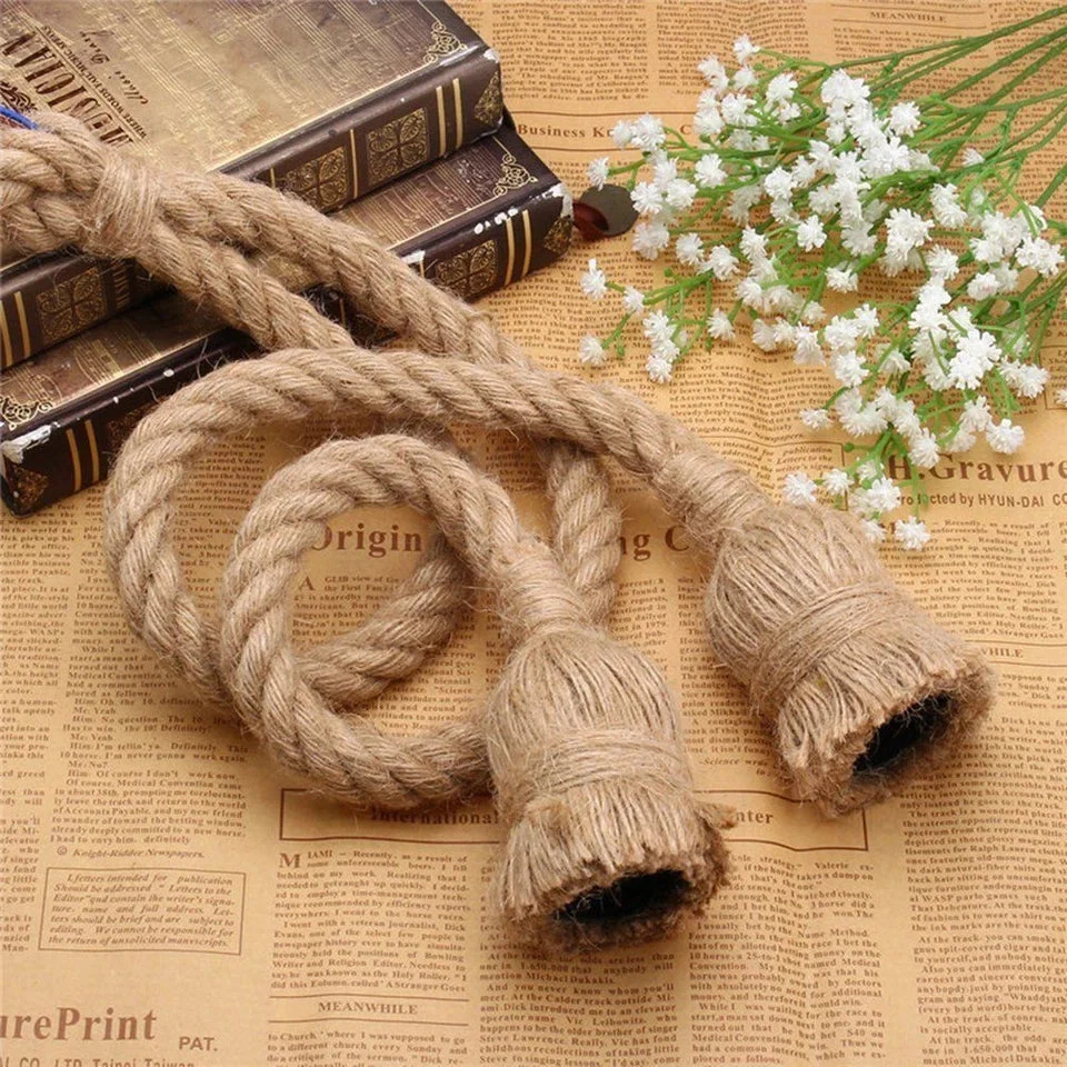 Hemp rope pendant light with natural twisted rope design hanging from ceiling in country vintage style setting