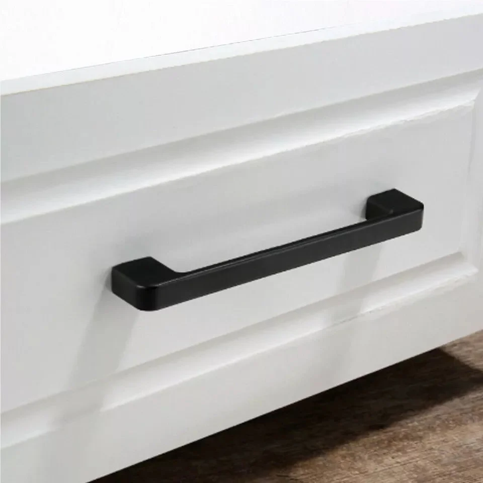 Matte black vintage metal cupboard handle mounted on wood, showcasing easy install cupboard handle design and grip.