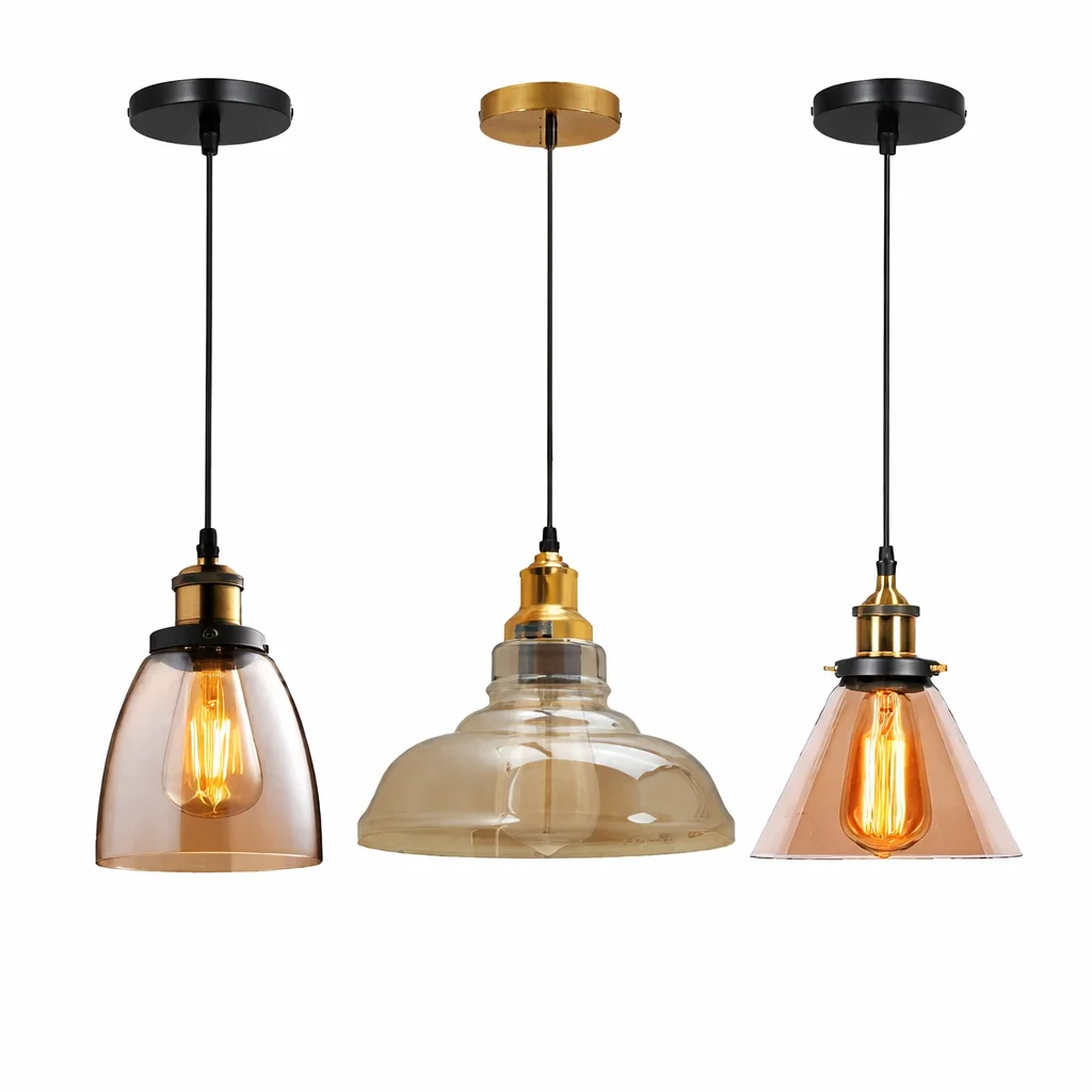 Bright amber glass pendant light with brass finish, hanging from a PVC cord, featuring a vintage‑styled glass shade