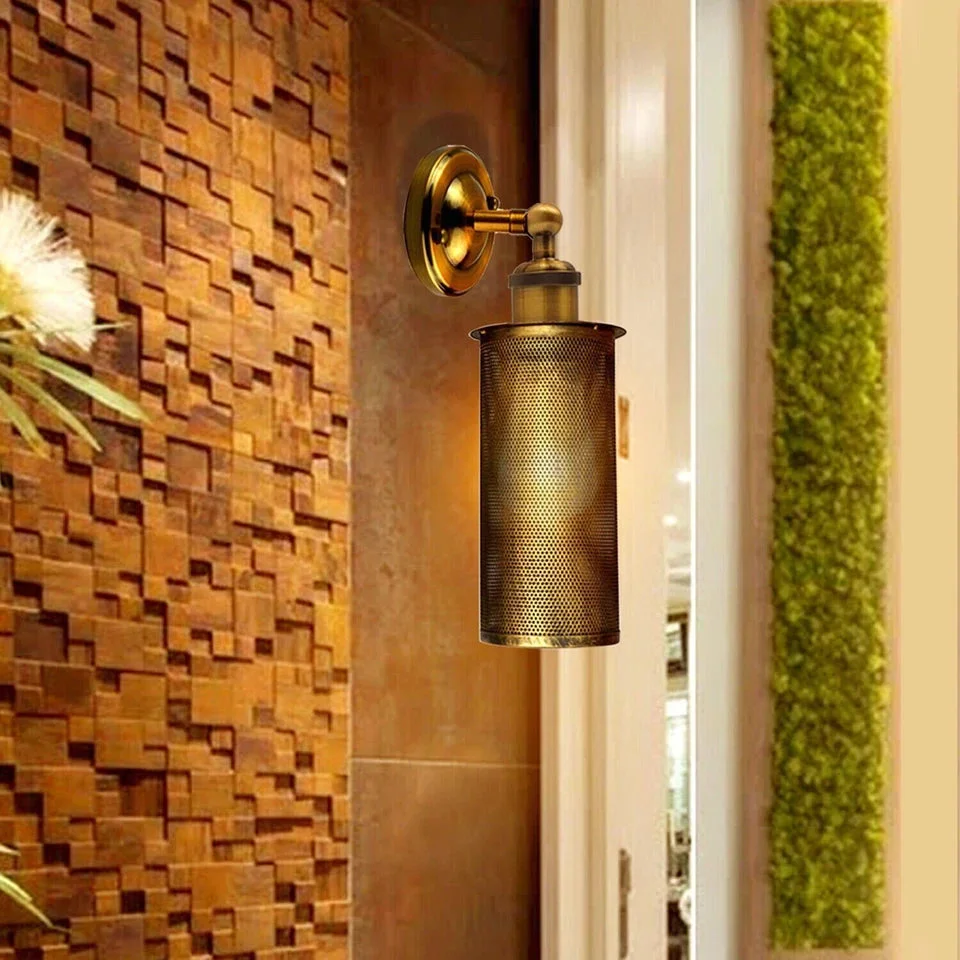 Vintage wall lamp with adjustable metal cage and black ceiling plate, showcasing retro industrial design and brass finish details