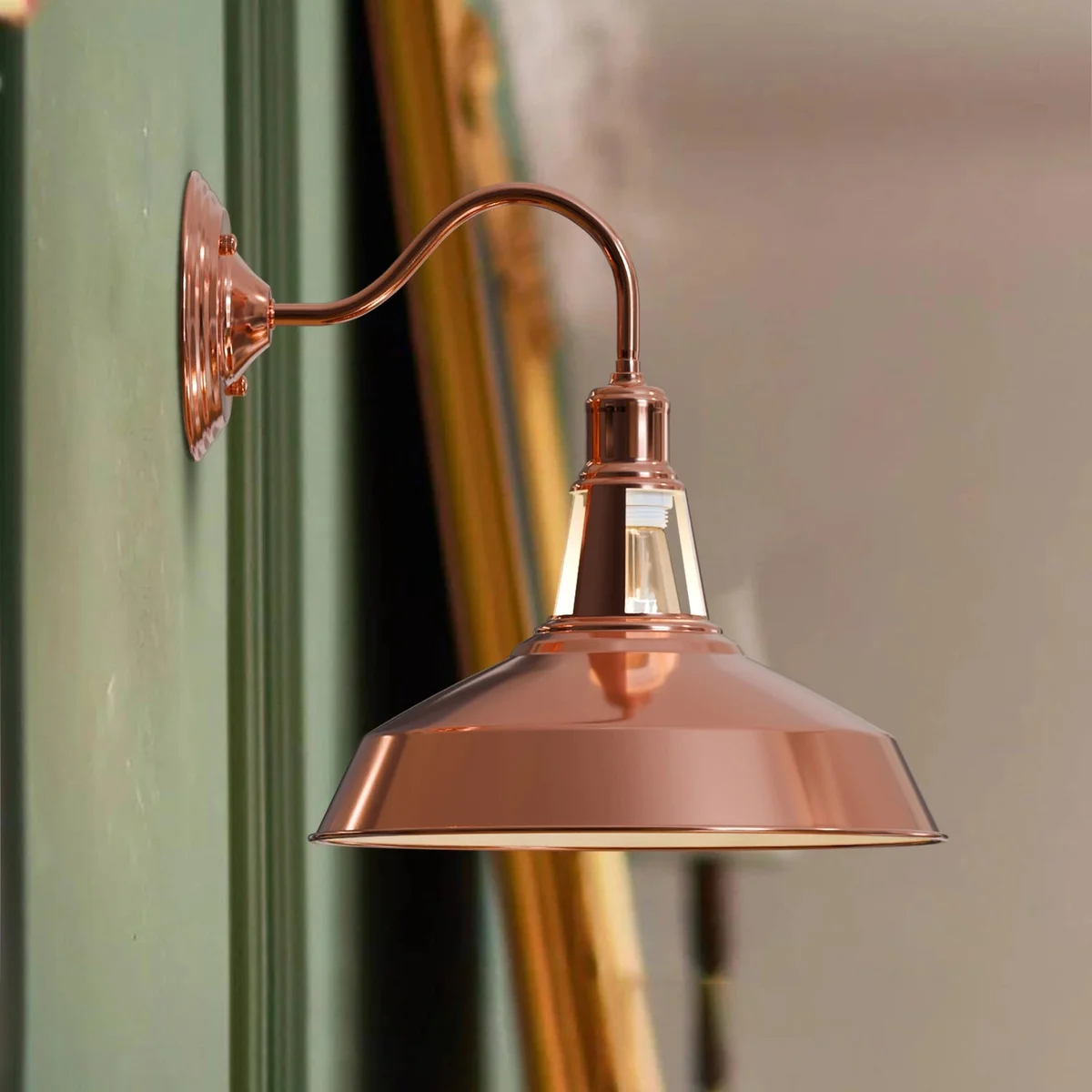 Modern wall sconce with rose gold metal barn slotted shade, vintage style, mounted on a wall with soft lighting effect