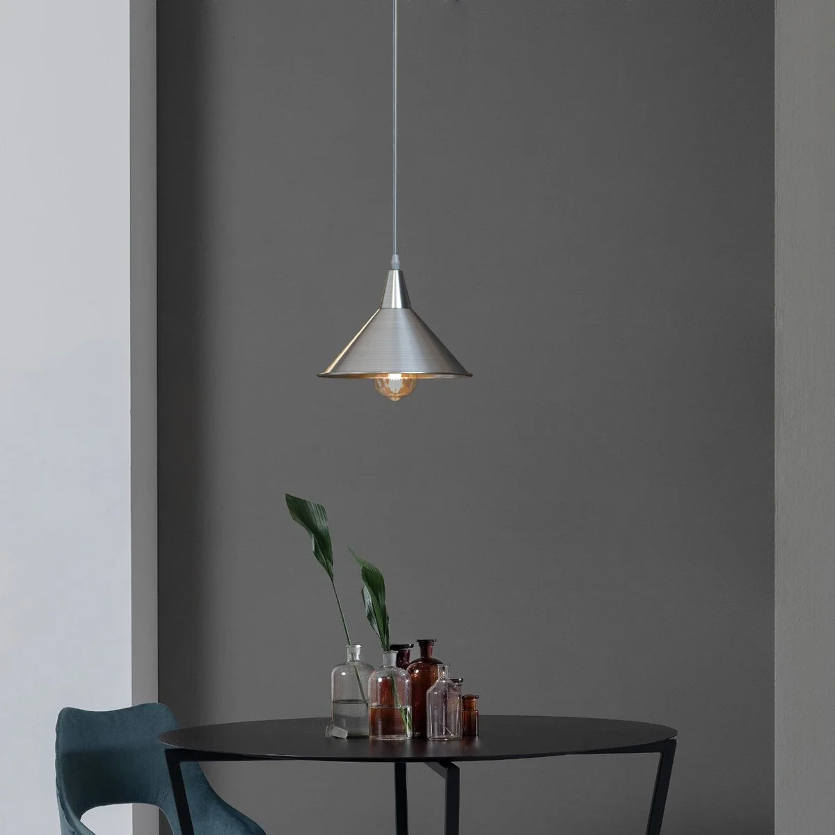 Chrome metal adjustable pendant light with cone shade and long adjustable cable for ceiling mounting in modern style