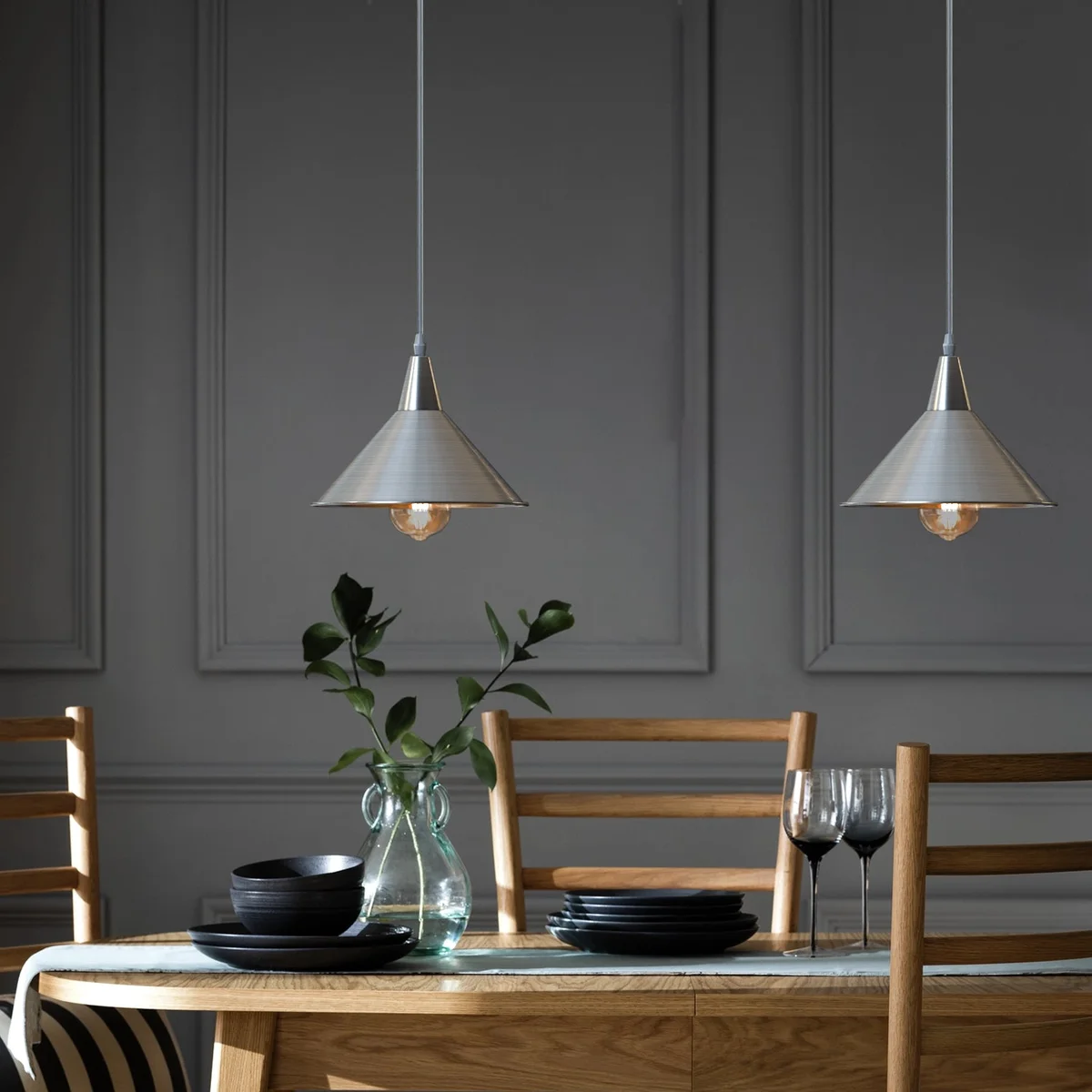 Chrome pendant light with adjustable long cable and cone metal shade, ceiling mounted for indoor use, modern style