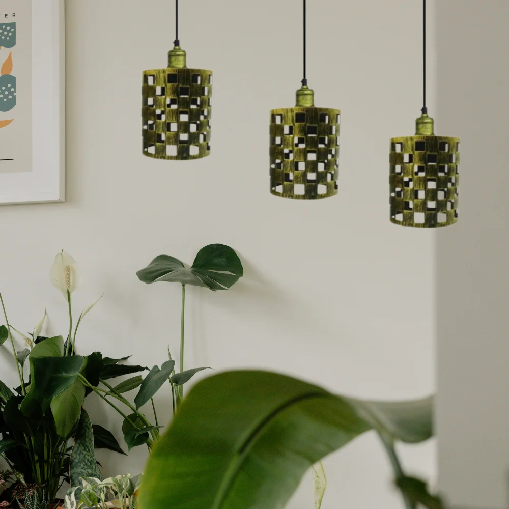 Antique brass pendant lights over a kitchen island, brass shade and metal ceiling pendant.