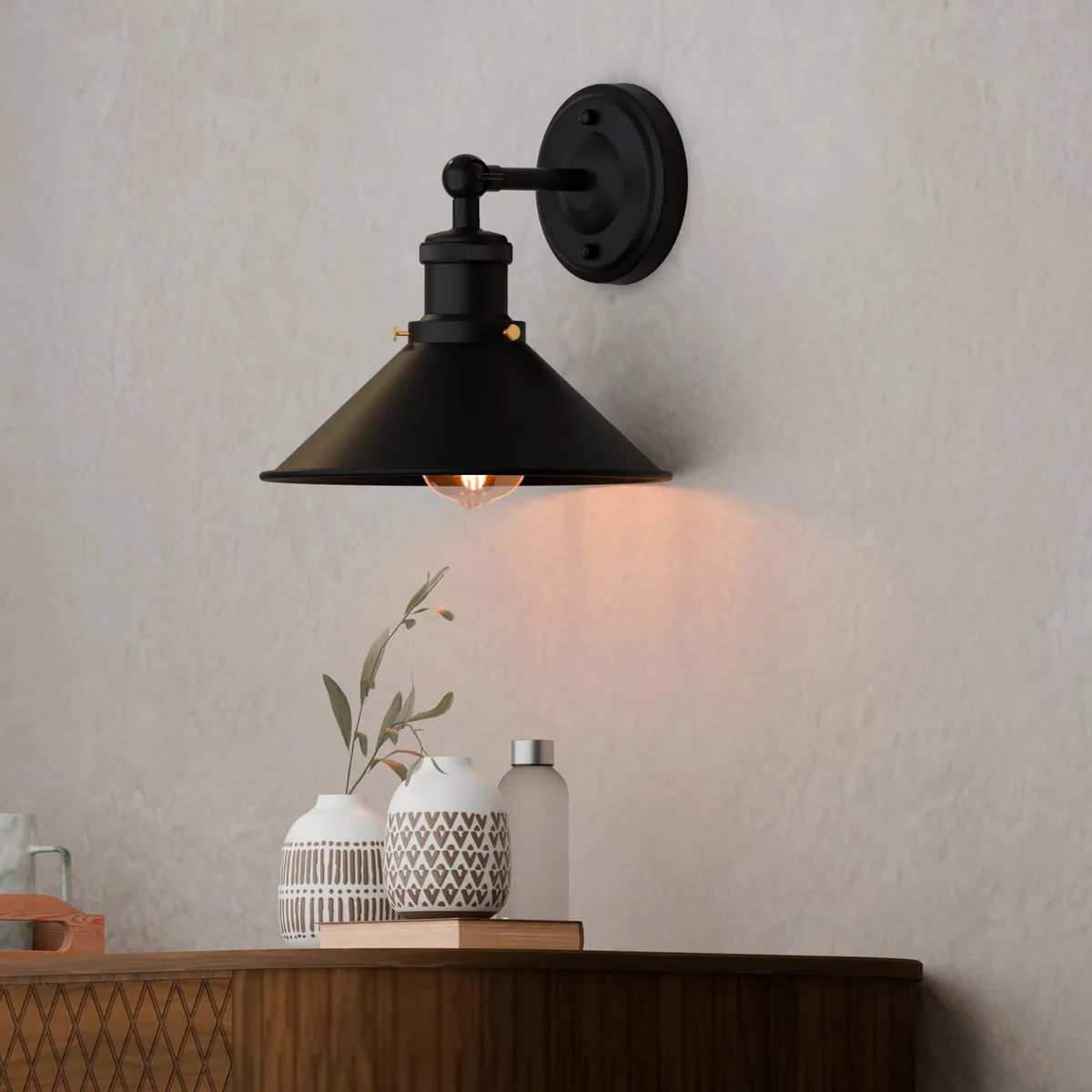 Black metal adjustable arm wall light with retro wall lighting style, E27 bulb base, shown mounted on white wall