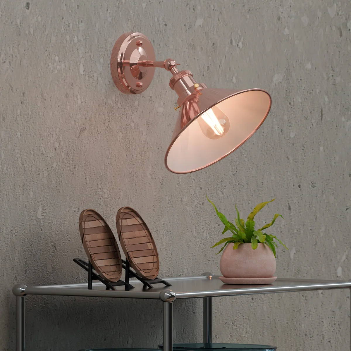Industrial metal wall light with adjustable arm and vintage-style metal shade mounted on white wall background
