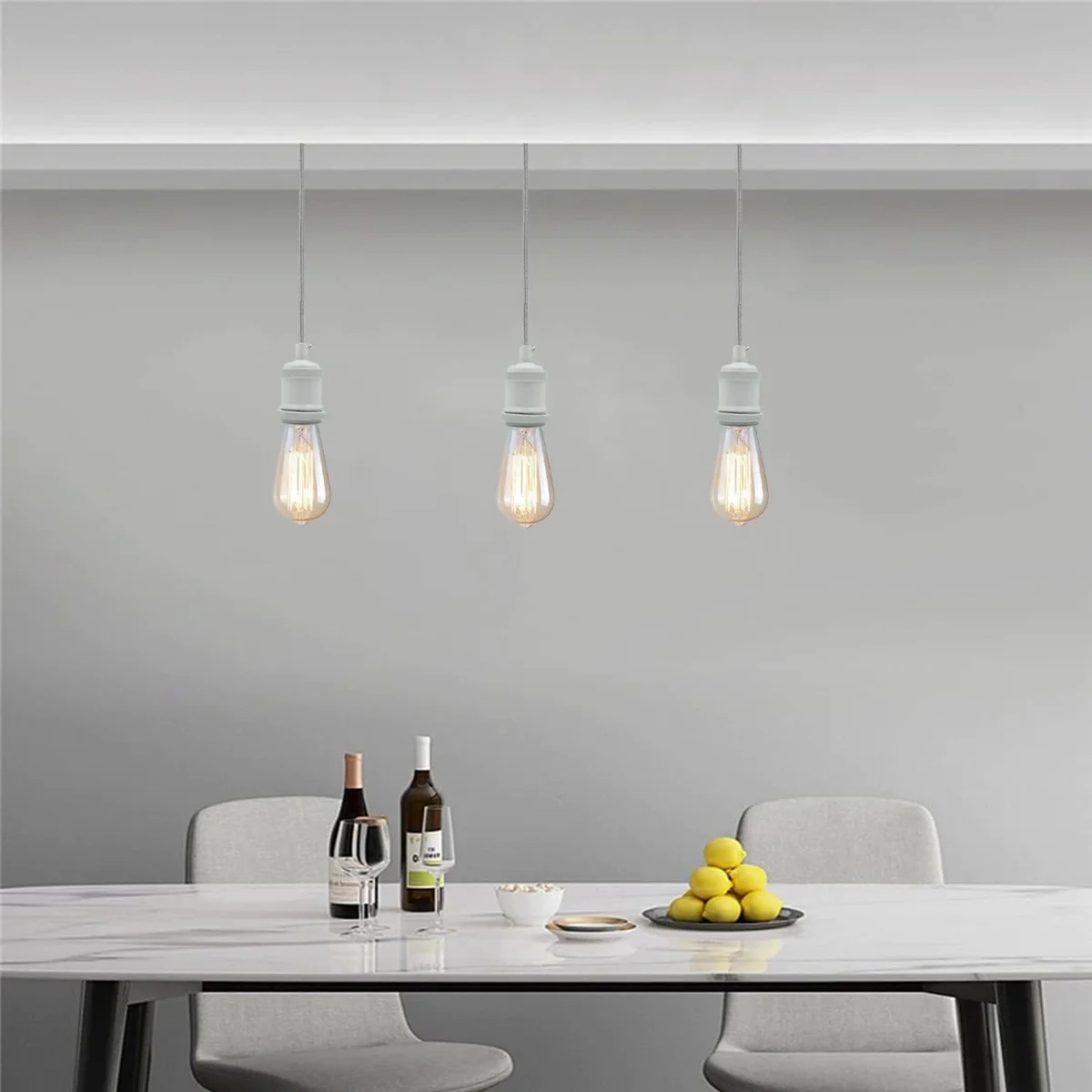 Black white pendant light with twisted fabric cable, white E27 holder, and matching ceiling rose shown hanging against white background