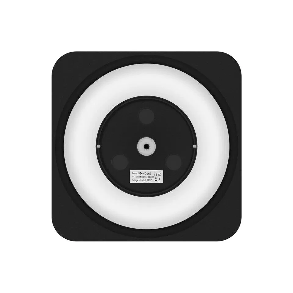 Black outdoor wall light with modern square design, warm white LED, mounted on a wall in an outdoor setting