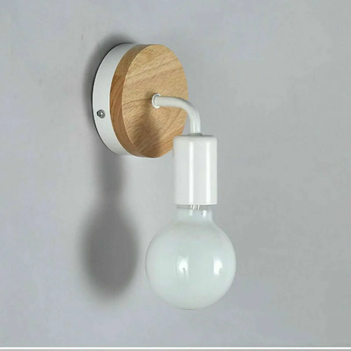Rustic wall lighting with wood and metal sconce, black finish, E27 bulb holder, mounted on white wall in modern room setting