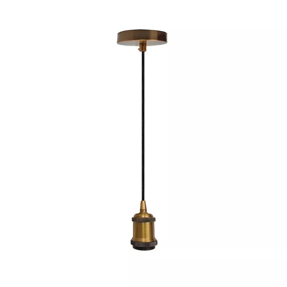 Yellow brass vintage pendant light fitting with ceiling rose and E27 bulb holder on white background