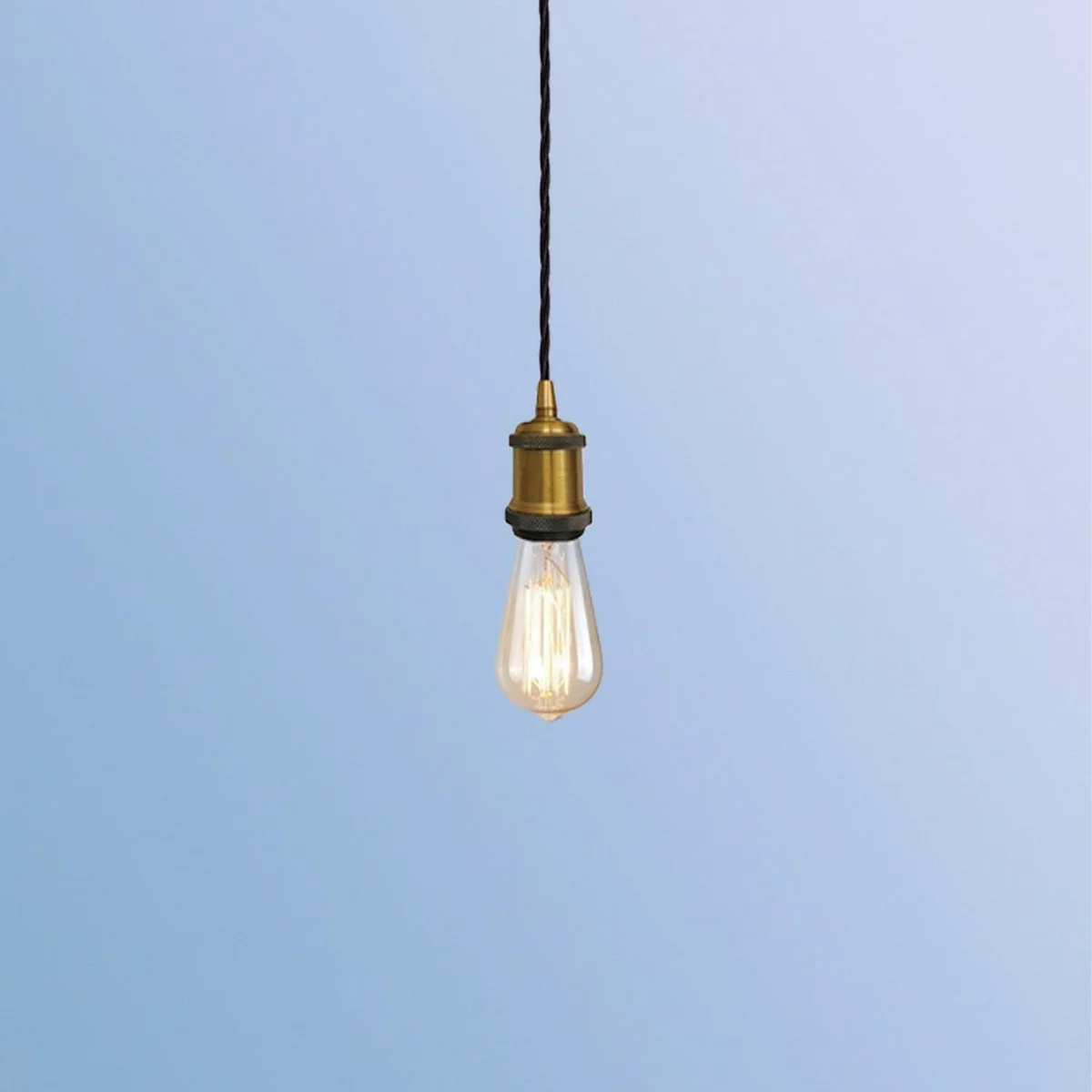 Yellow brass vintage pendant light fitting with ceiling rose and E27 bulb holder on white background