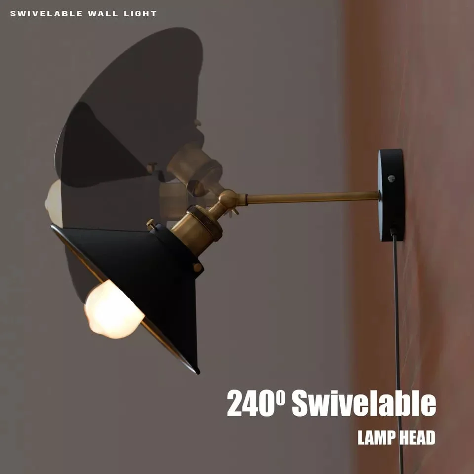 Black metal vintage style wall lamp with adjustable cone shade mounted on industrial indoor wall sconce