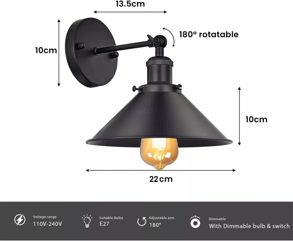 Black metal industrial modern wall sconce with adjustable cone-shaped shade mounted on white wall