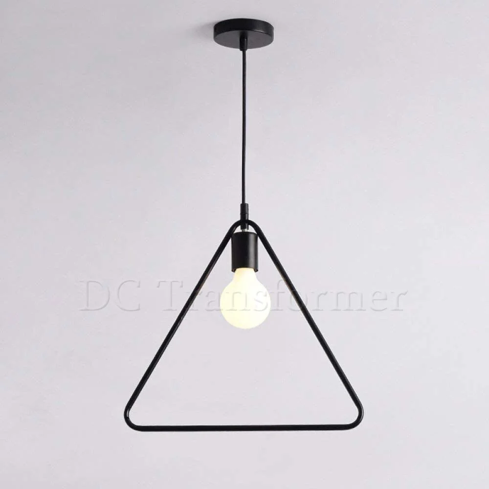 Black industrial pendant light with metal wire cage, round shape, hanging from ceiling with exposed bulb holder