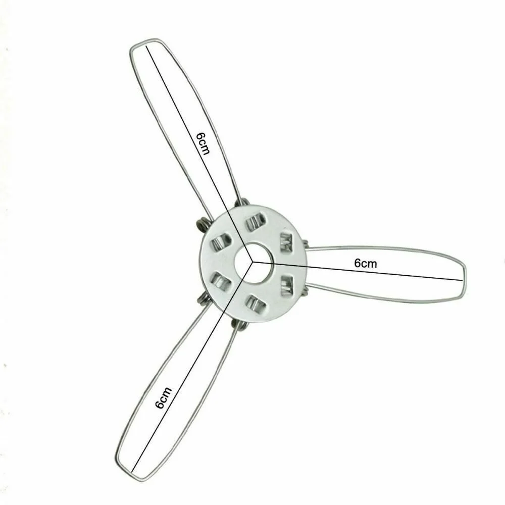 Circular metal lamp shade clip with three wire arms, used for securing and supporting lamp shades