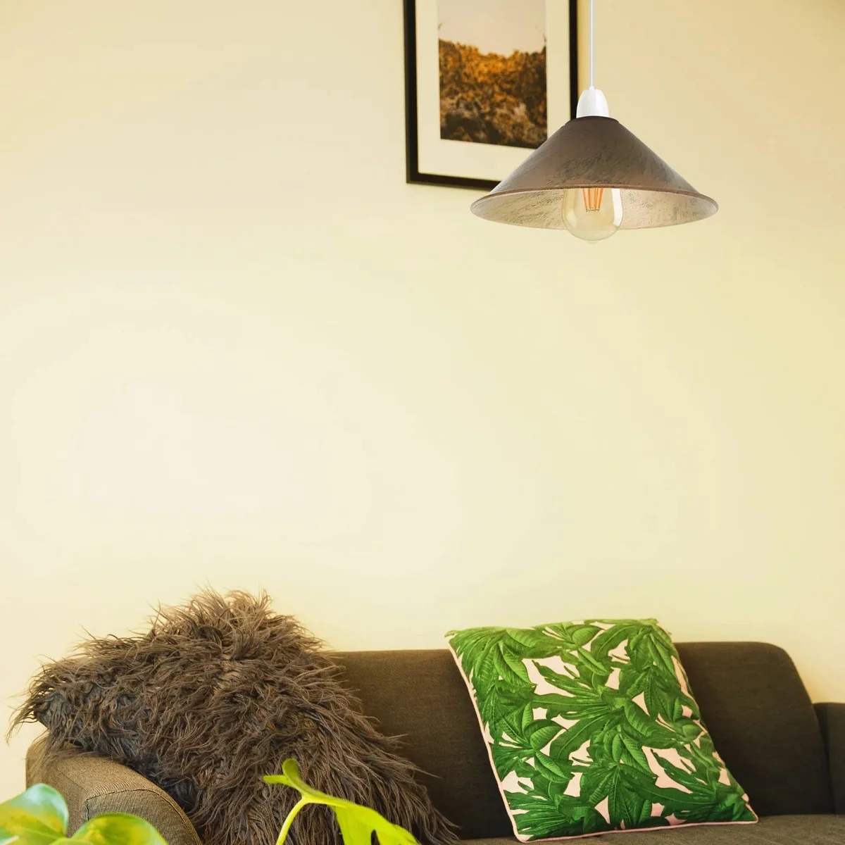 Retro metal ceiling light shade in brushed brass, cone shape, 22cm diameter, shown hanging indoors on white background