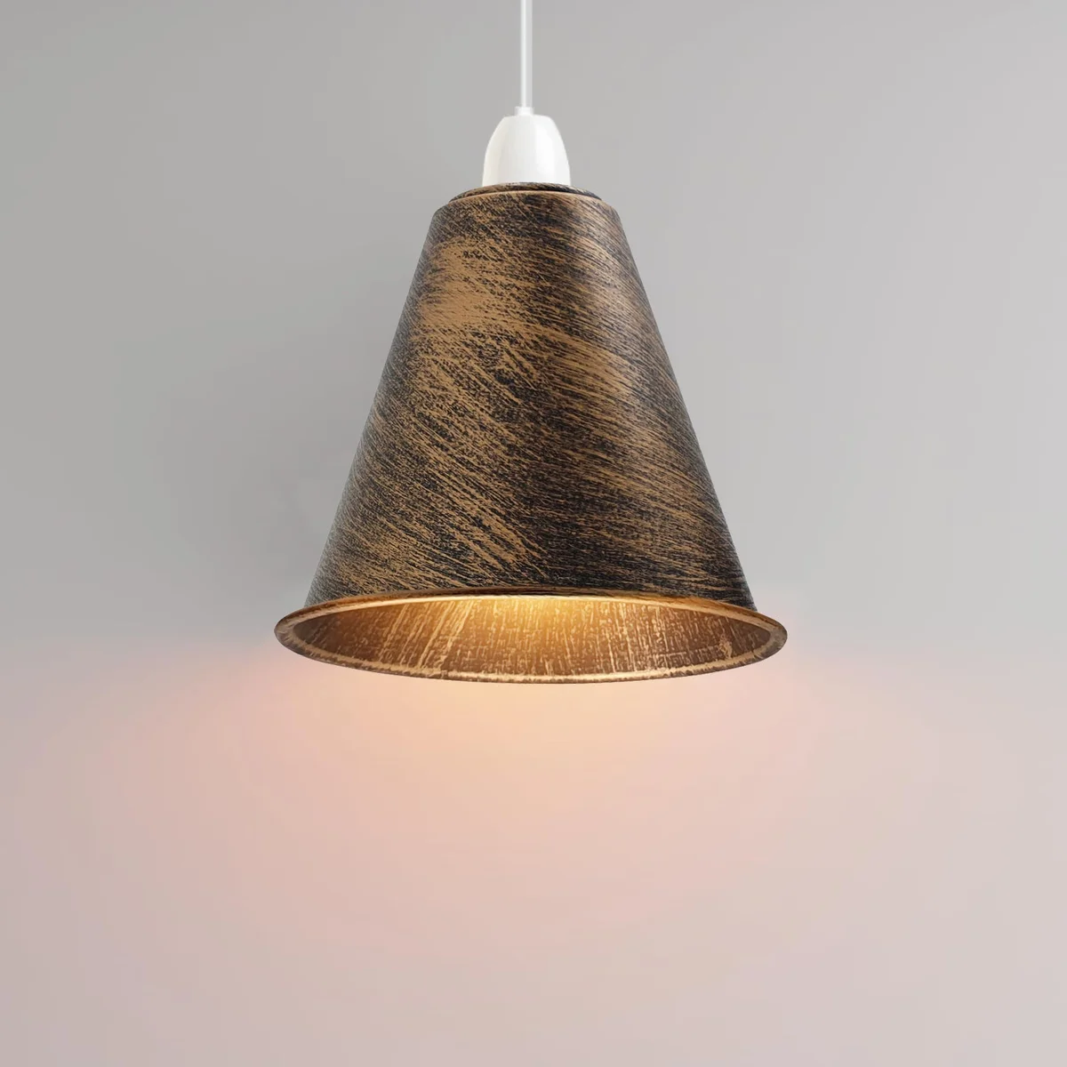 Black industrial ceiling lamp shade with concrete effect finish hanging in modern living room setting