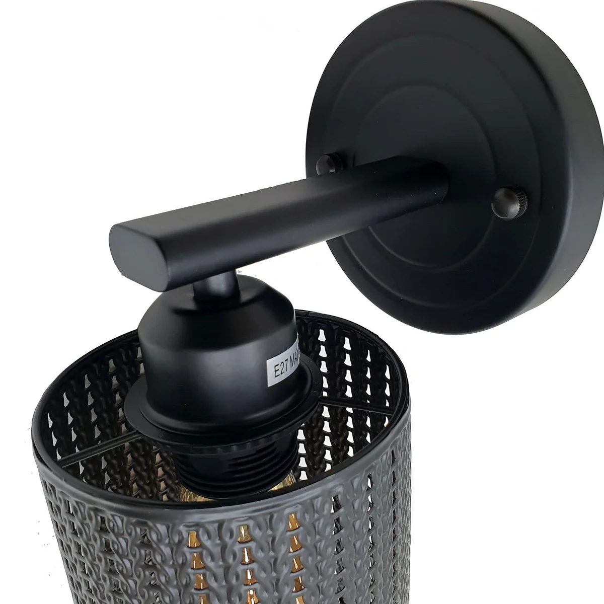 Modern industrial retro wire cage modern wall sconce with metal shade and E27 holder mounted on white wall background