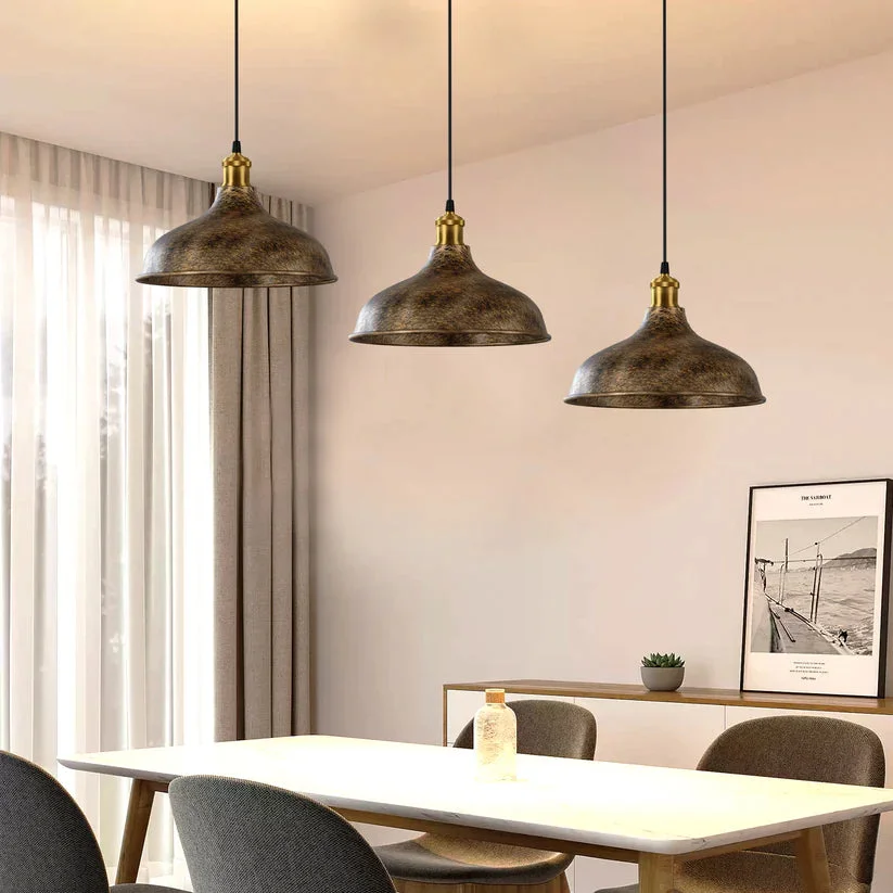 Vintage brushed copper modern pendant lamp with matte black sculptural shade hanging from ceiling cable