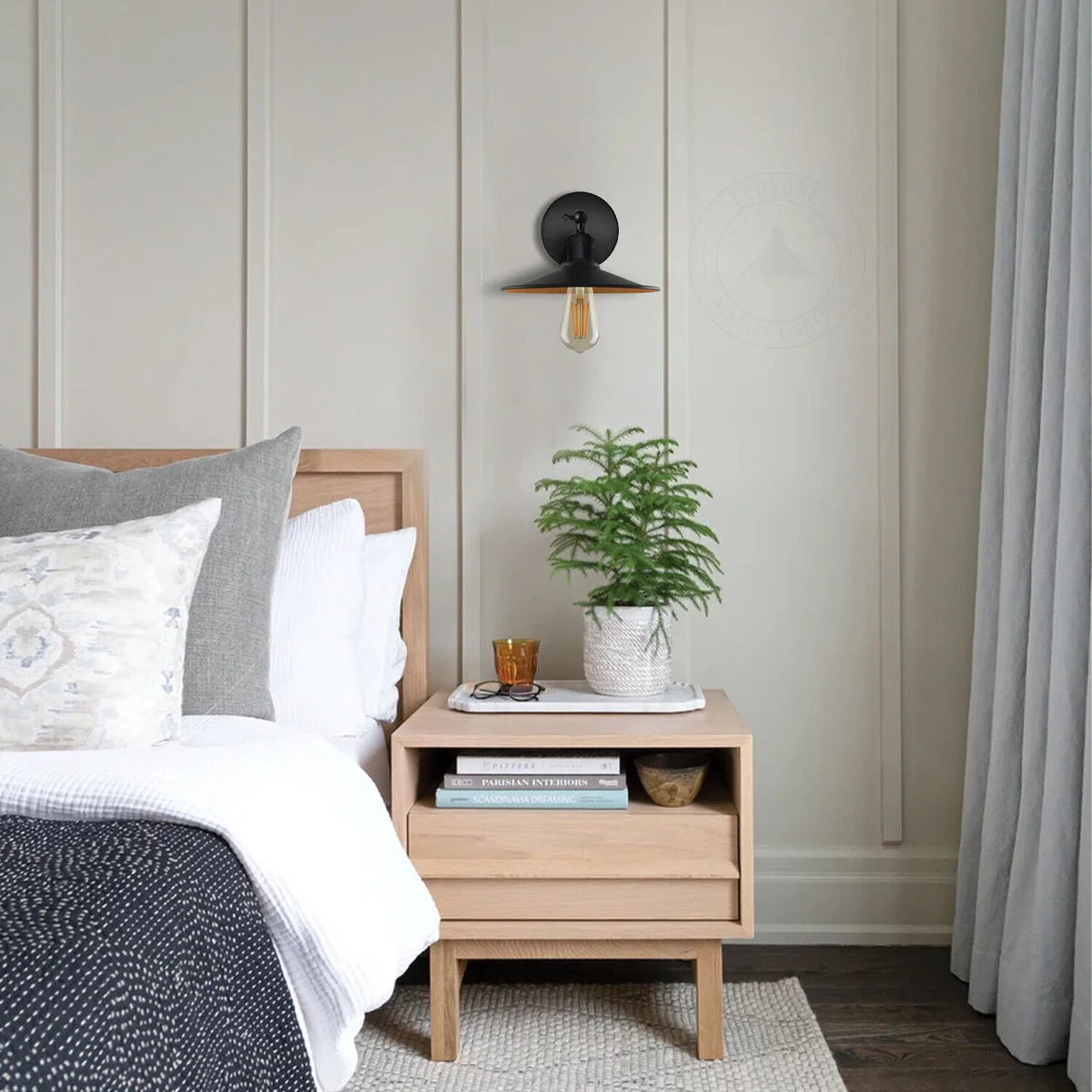 Black wall sconce with metal cone-shaped shade, vintage industrial style, mounted on wall with E27 bulb holder and arm