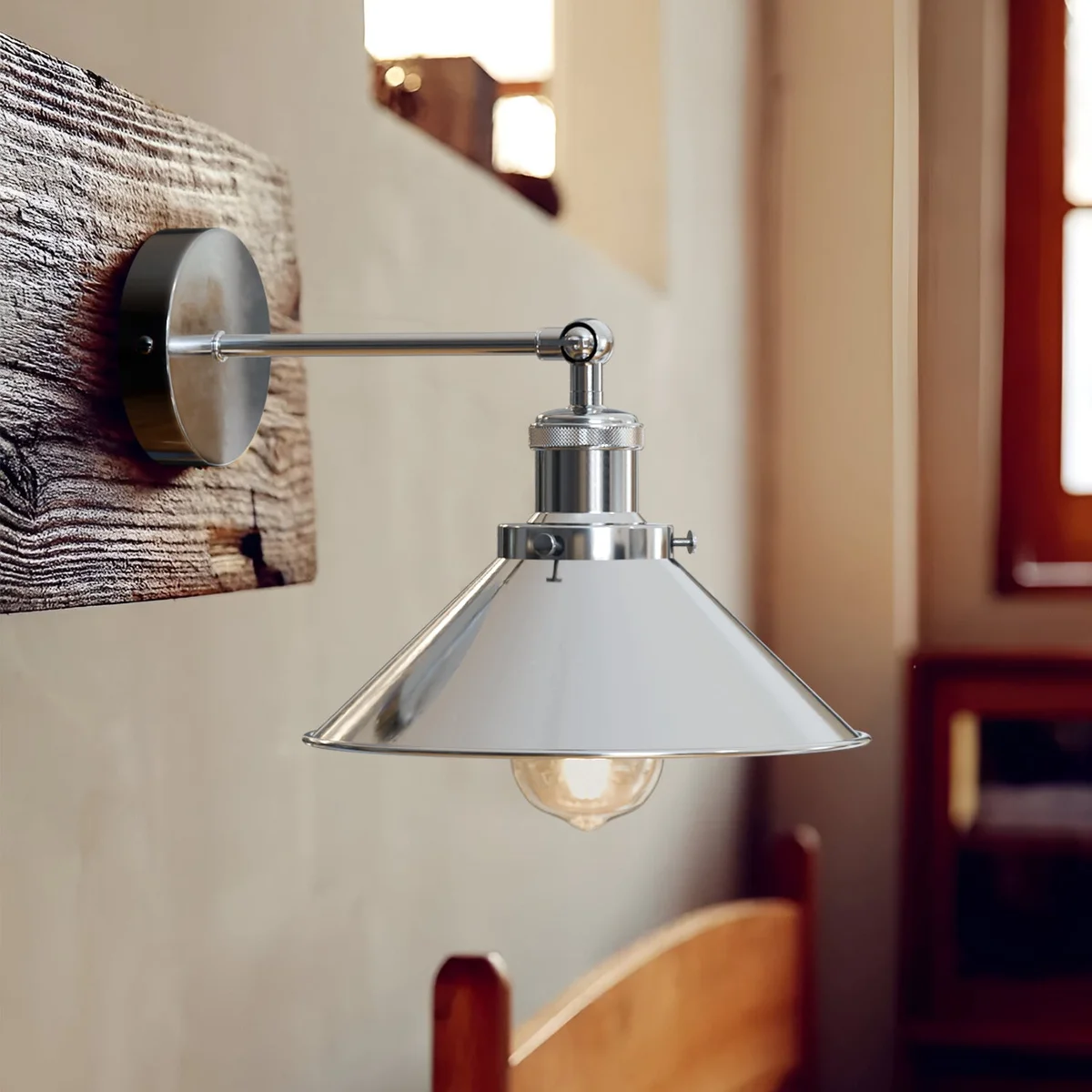 Satin nickel cone shade wall lamp with adjustable arm, 22 cm diameter and 10 cm height.