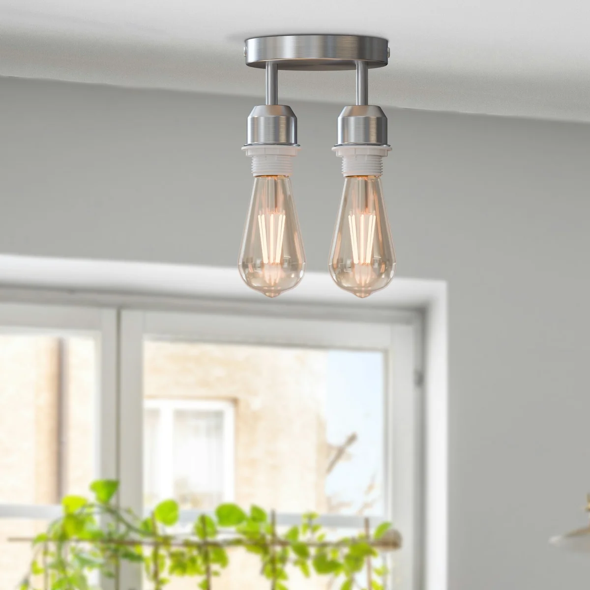 Modern industrial 2 way ceiling light with circular metal ceiling rose and twin E27 lamp holders mounted on white ceiling