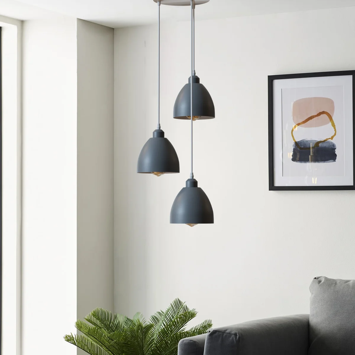 Industrial 3-head pendant light with metal shades and adjustable cable ceiling light hanging from a ceiling rose