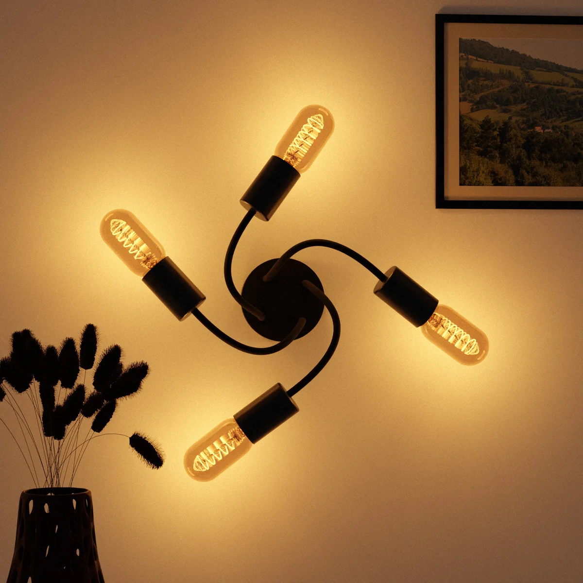 Modern black ceiling LED light with 4 adjustable metal arms and E27 bulb sockets for indoor home décor