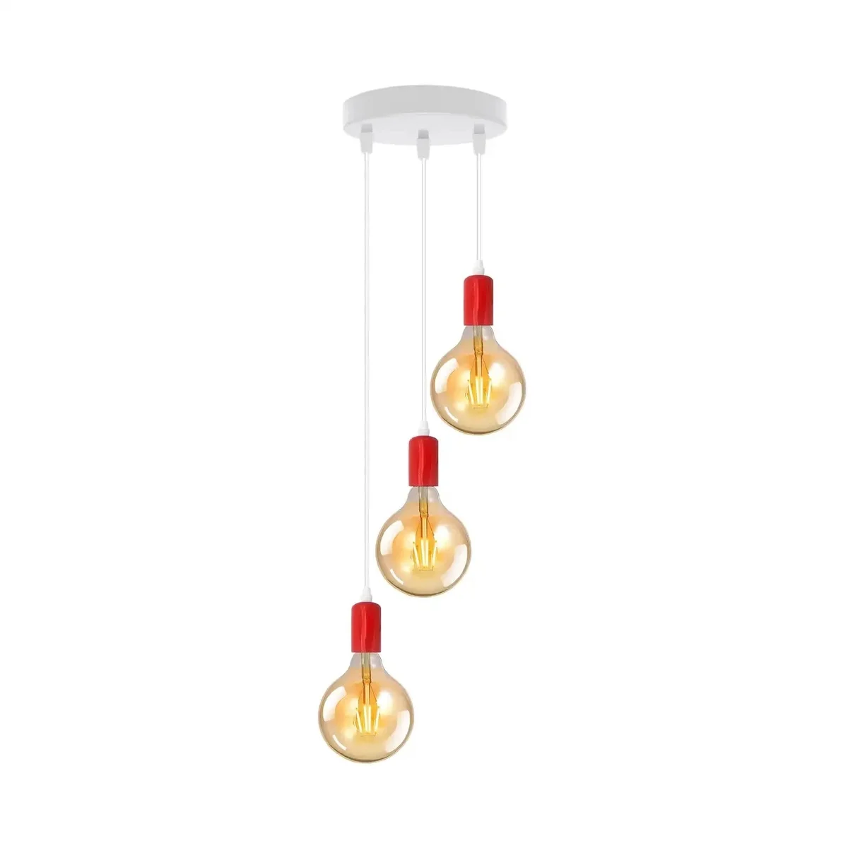 Three vintage pendant light bulbs with amber glass hanging from metal ceiling fixture in cluster design