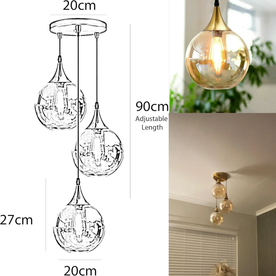 Three-light amber glass pendant light with warm copper finish and adjustable cords hanging against white background