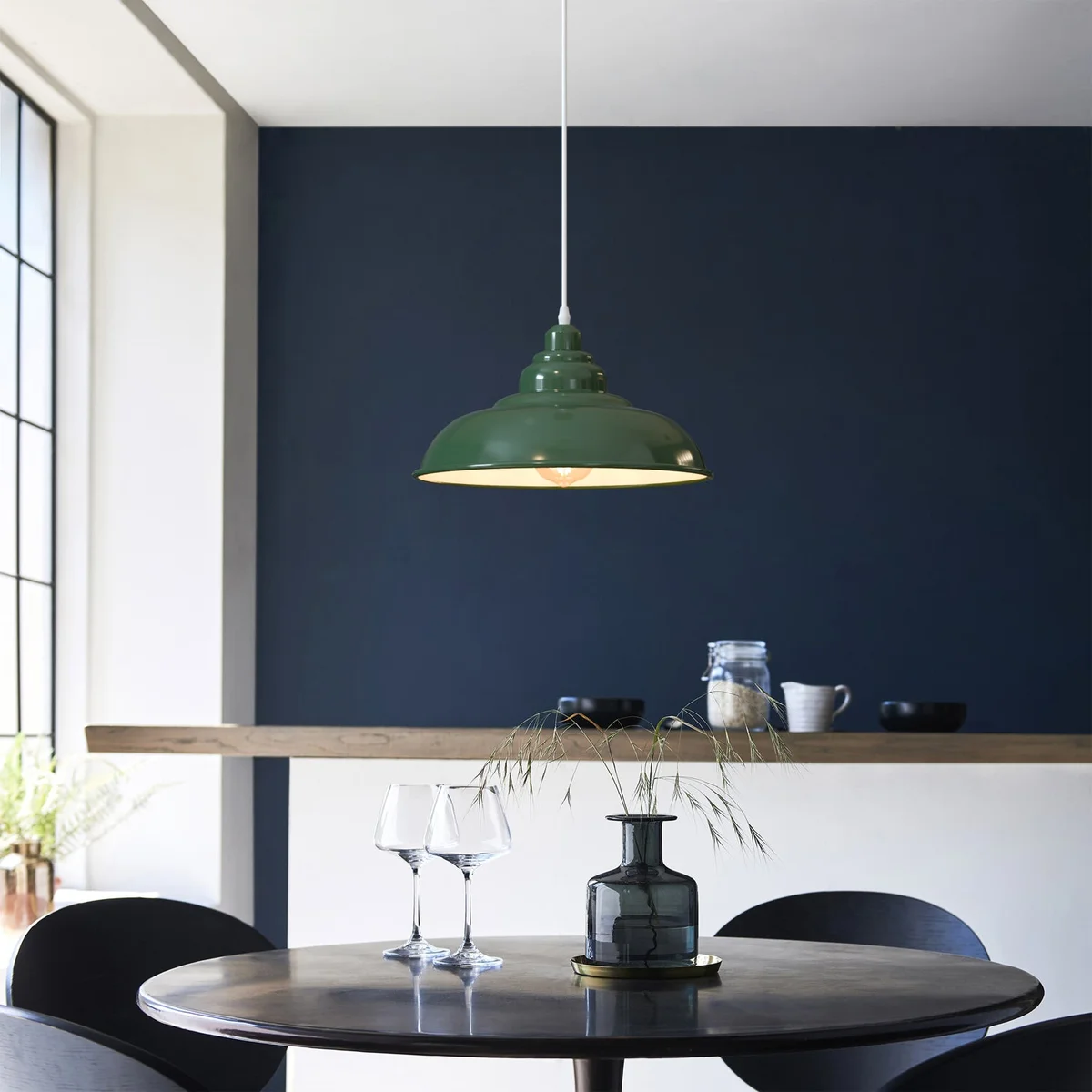 Vintage retro style metal shade ceiling light with E27 bulb base hanging from ceiling in modern interior setting