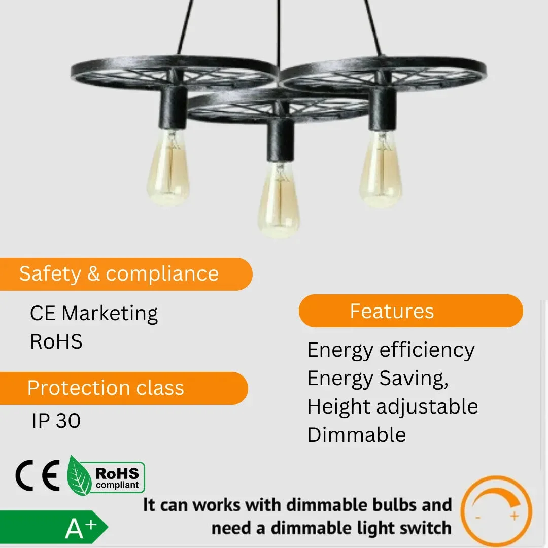 Matte black ceiling light with industrial wagon wheel design and three Edison-style bulbs hanging in rustic setting