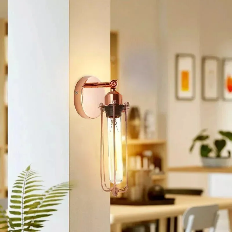 Rose gold retro industrial wall lamp with adjustable metal shade mounted on a wall, ideal for home or cafe decor