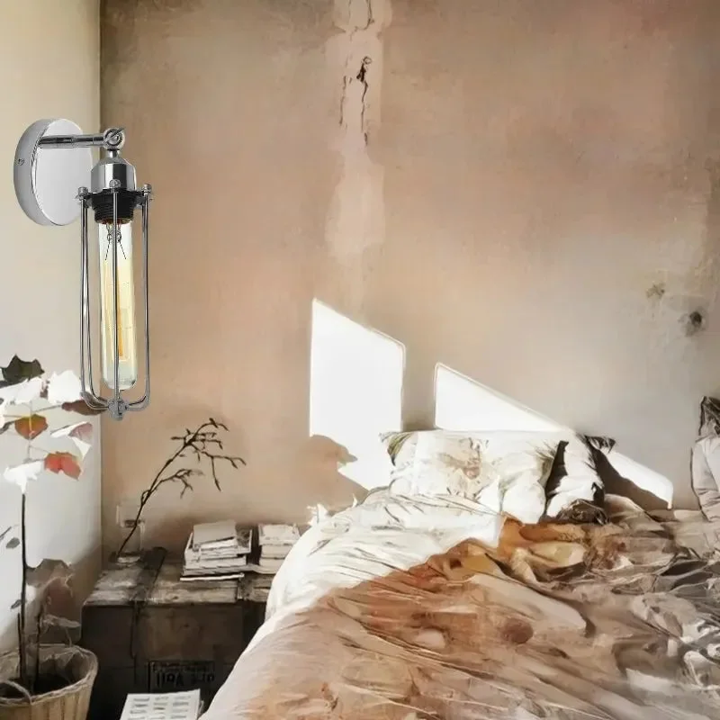 Adjustable industrial style lamp wall sconce with chrome metal cage and E27 bulb holder mounted on white wall