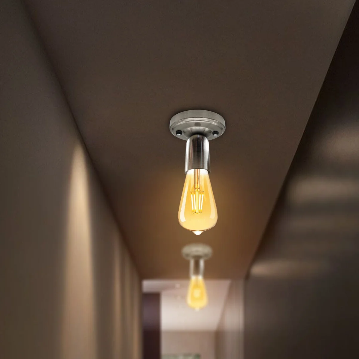 Vintage style metal flush mount lamp with round ceiling plate and E27 bulb holder in a warm indoor setting