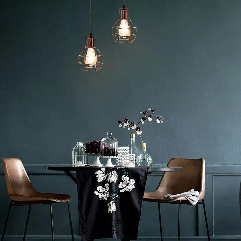 Black rustic light pendant with metal cage lampshade hanging from ceiling, industrial style vintage design with adjustable cable