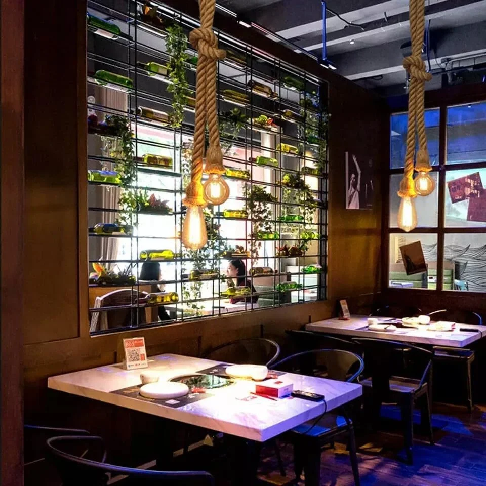 Double head hemp rope pendant light with two E27 sockets hanging from adjustable natural hemp ropes against white background