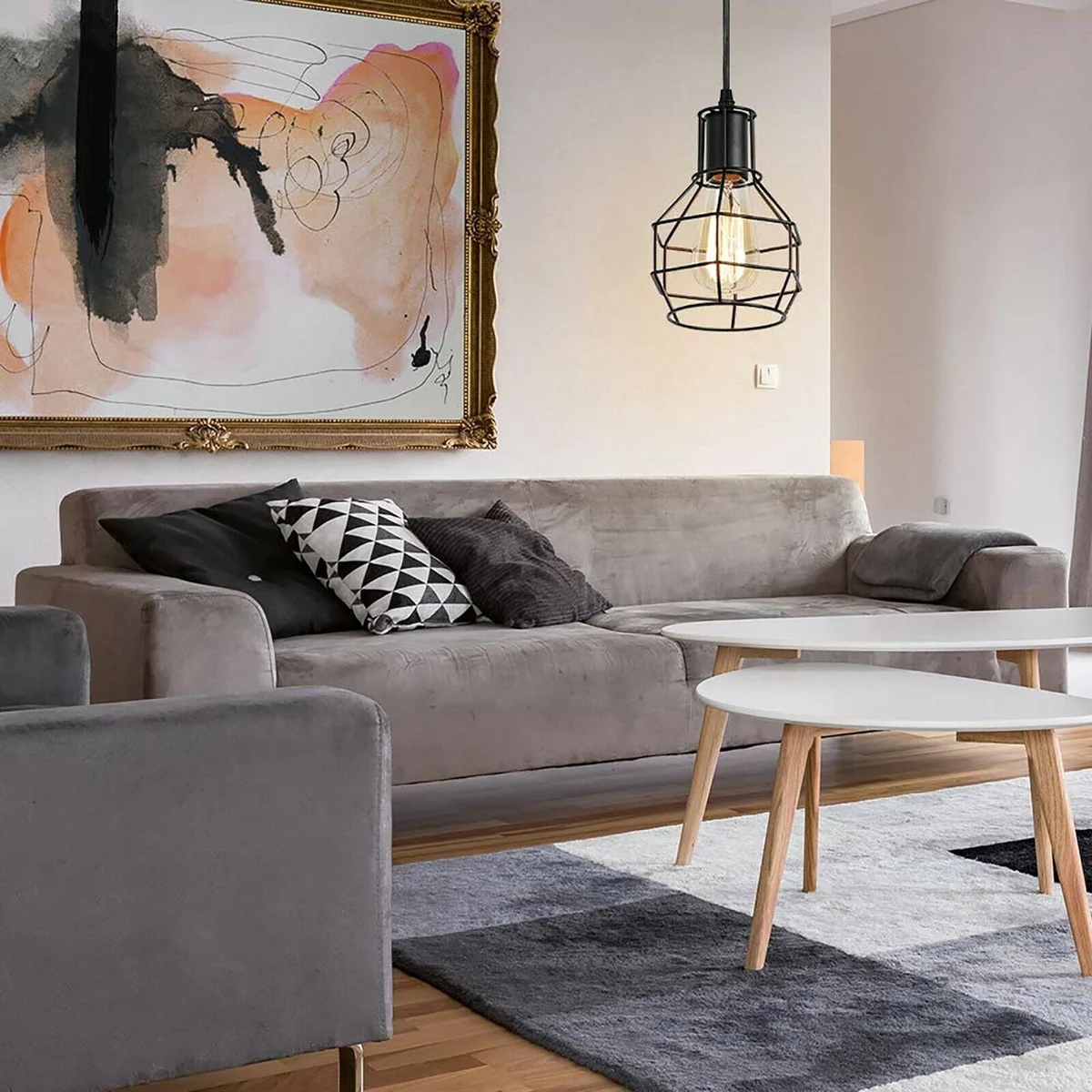 Brushed silver metal industrial wire cage pendant light with spiral design hanging from ceiling cable