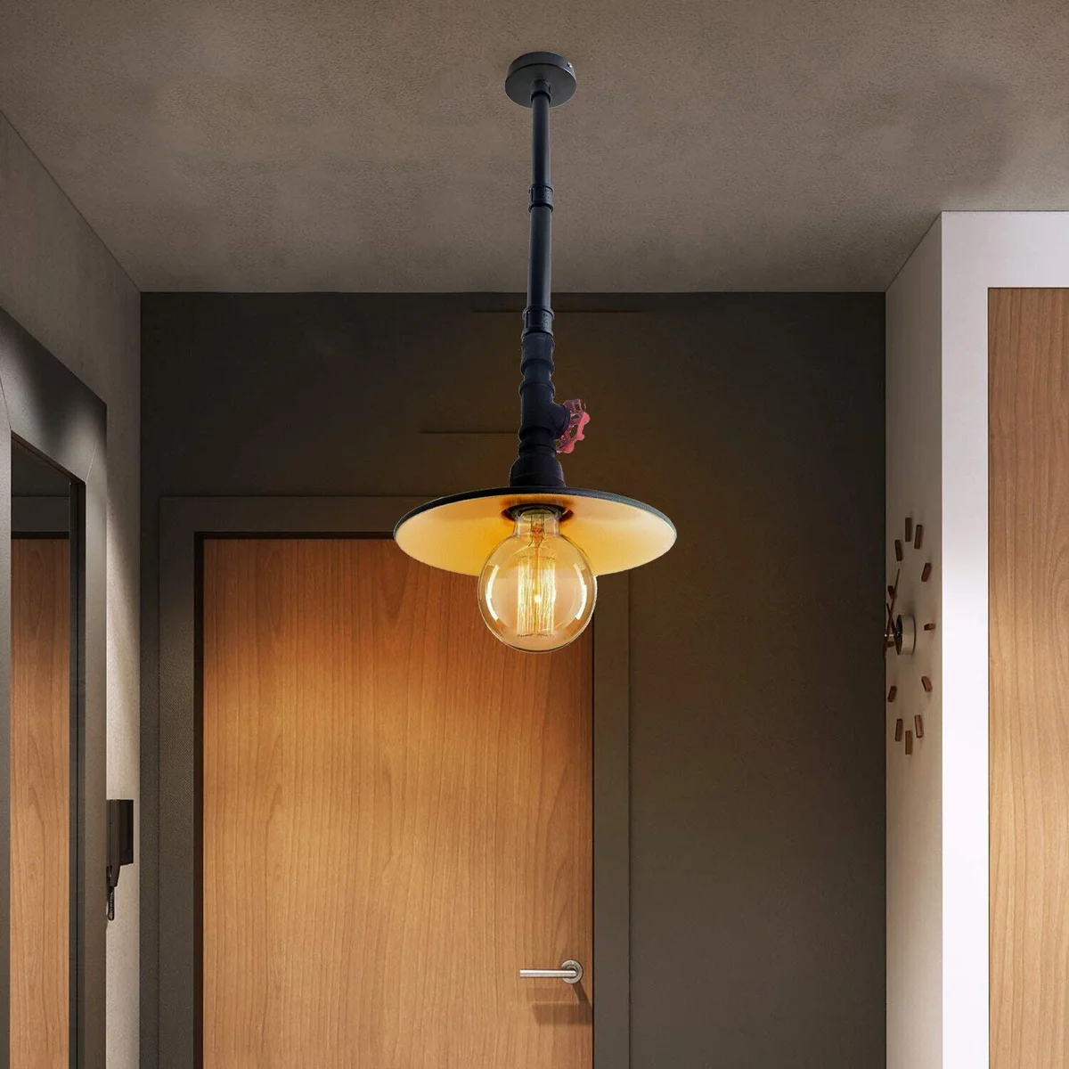 Black iron pendant light with galvanized finish and gold interior, industrial steampunk style ceiling fixture