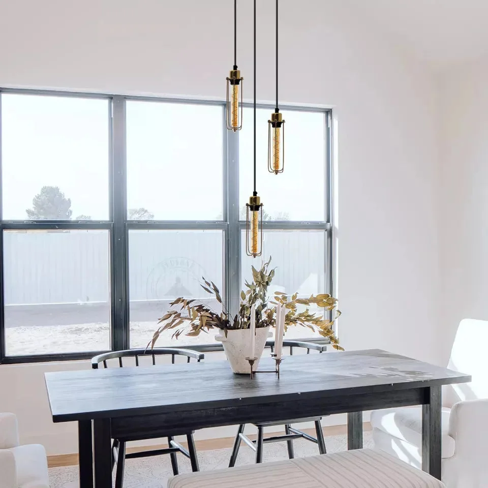 Vintage pendant ceiling light with three black metal cage lamps hanging from adjustable cords in industrial style