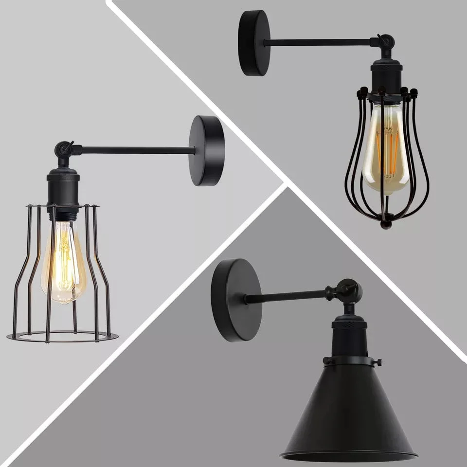 Rust resistant wall light with adjustable arm and antique brass finish mounted on a white wall indoors