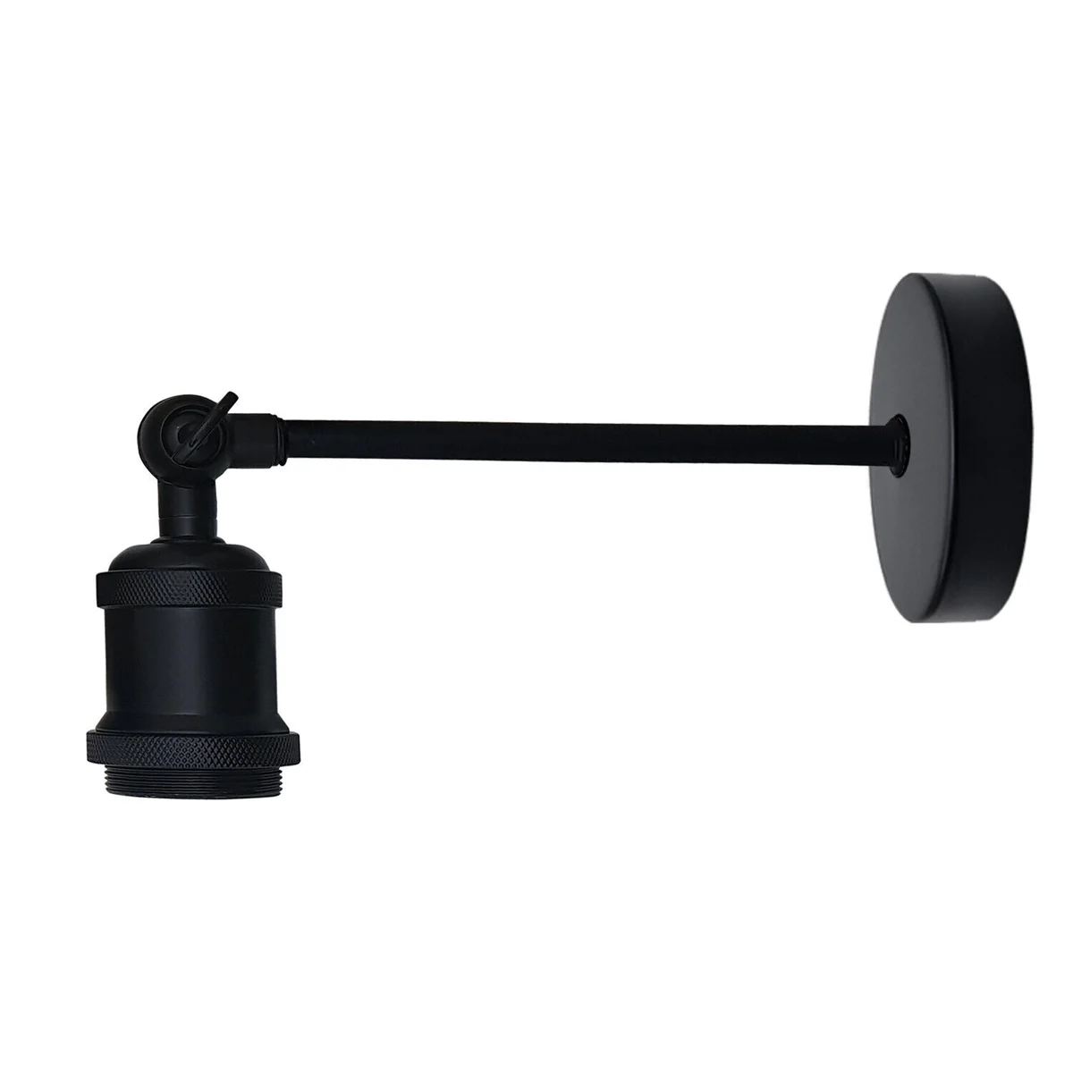 Vintage industrial wall light with adjustable arm, antique brass finish, mounted on a white wall in a living room setting