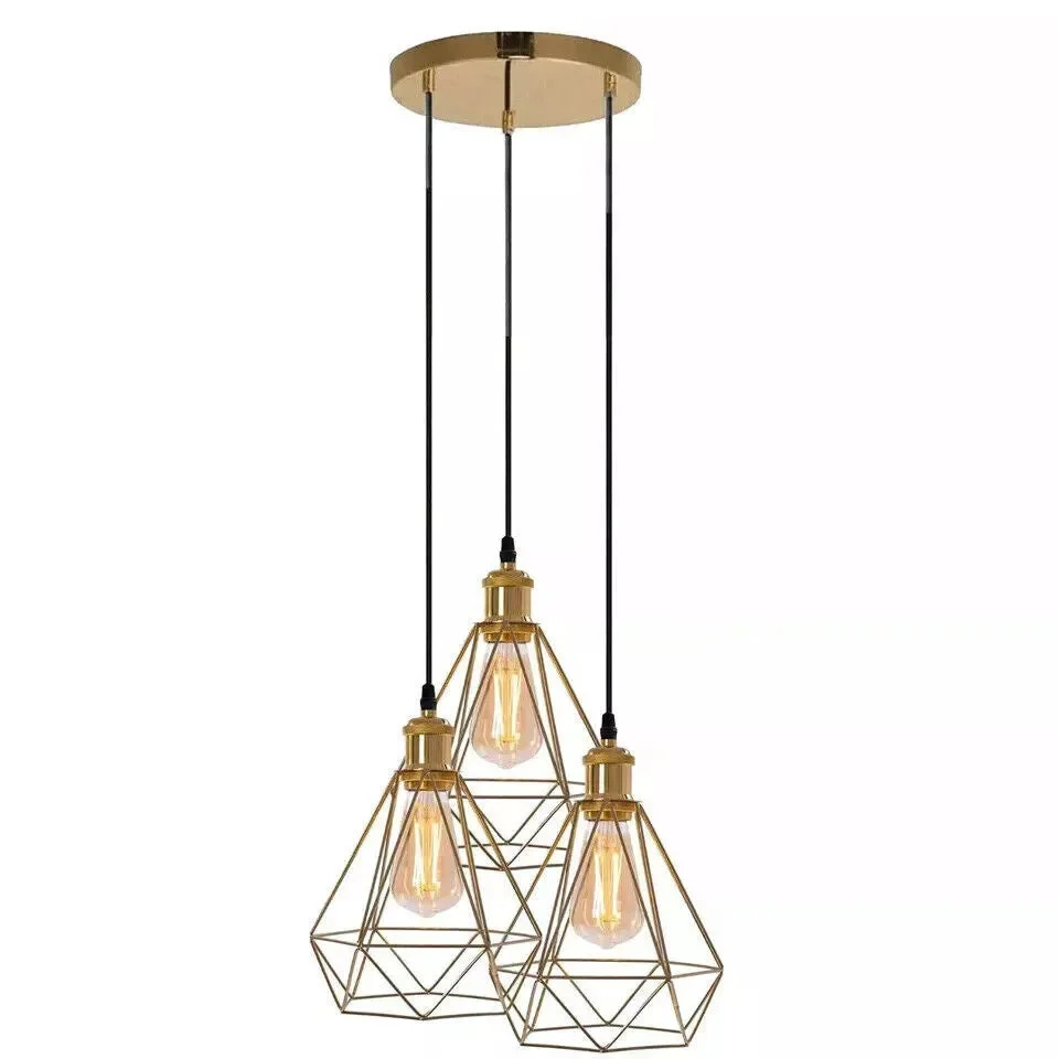 Three-bulb industrial pendant light with French Gold metal cage and adjustable drop cables hanging from ceiling