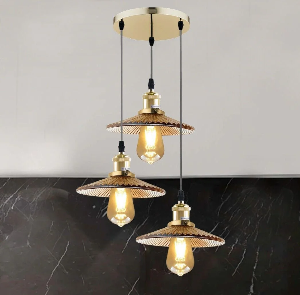 Vintage industrial 3 way ceiling lamp with amber glass shades and sturdy metal pendant design hanging indoors