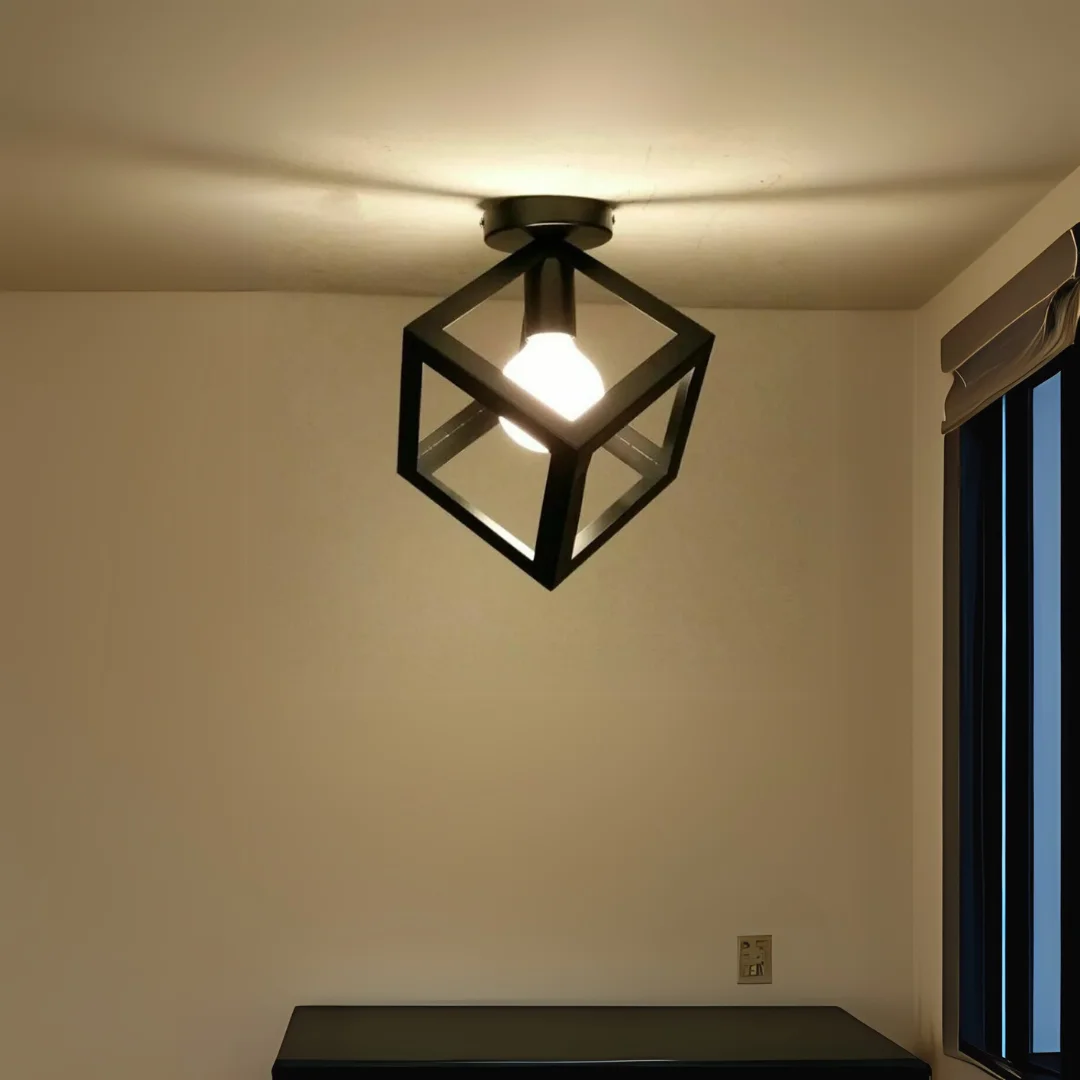 Black industrial cage kitchen ceiling light with geometric metal design and included bulb flush mounted on ceiling rose