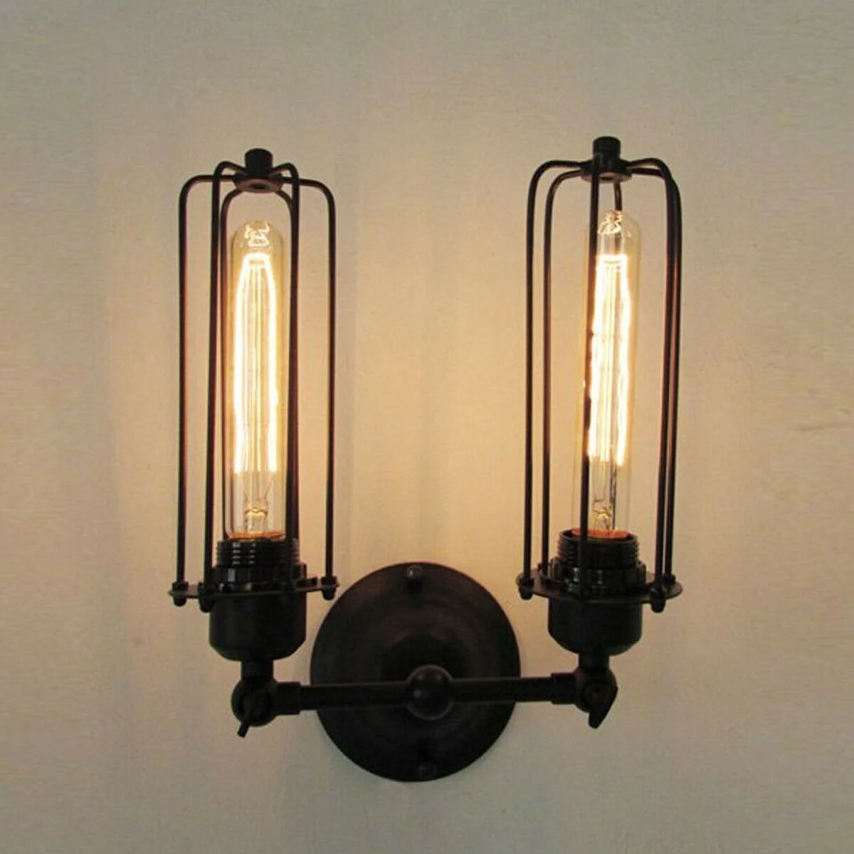 Vintage industrial wall light with black iron cage, adjustable arm, high‑gloss finish, mounted on wall, LED illumination.