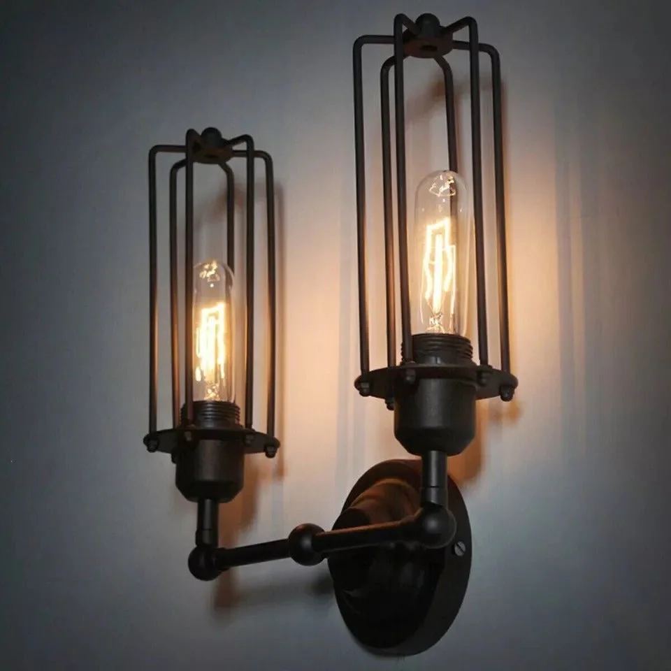 Black iron vintage wall light with adjustable metal cage, mounted on wall, LED bulb visible, sleek industrial design.