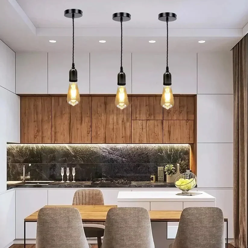 E27 cluster pendant light with multiple metal fixtures and gold twisted fabric flex hanging from ceiling rose